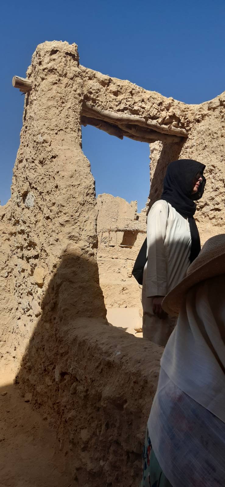 picture of Jo in the Oracle temple in galabeya and scarf to keep out the sun